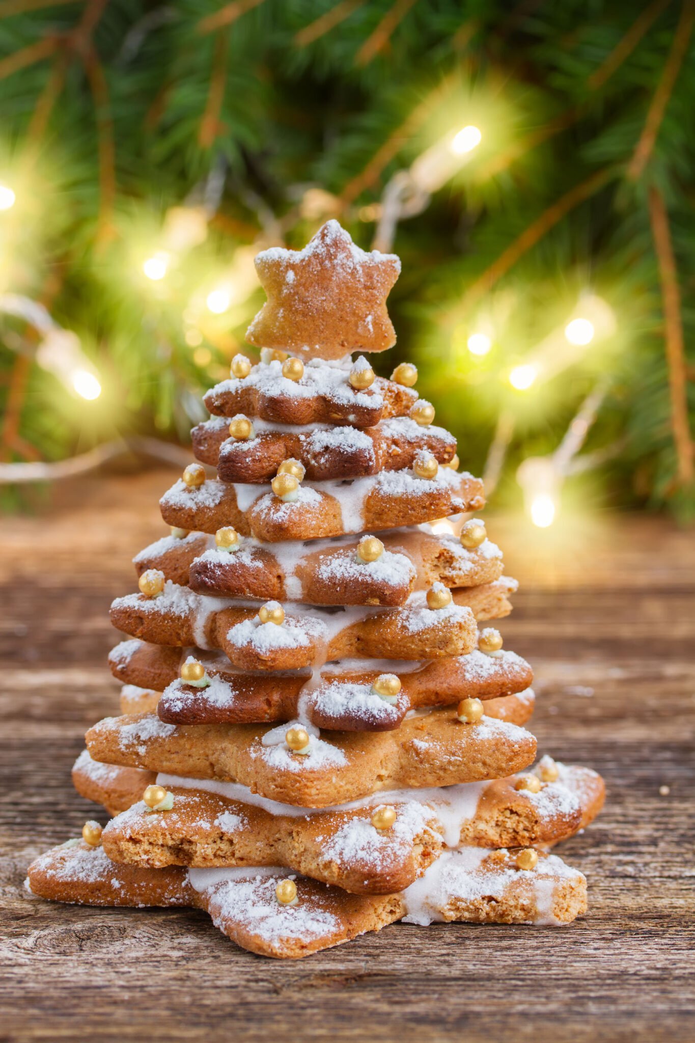 gingerbread tree is easy to make with stacked gingerbread cookies and frosting