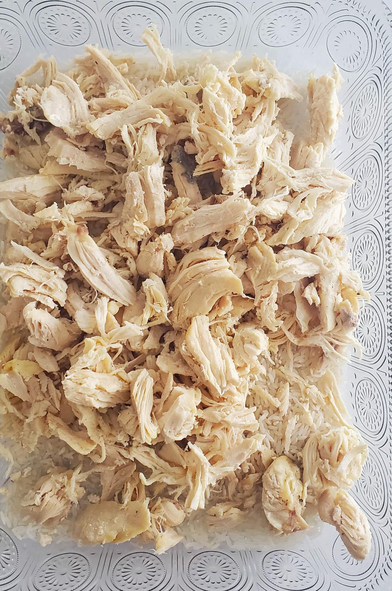 shredded chicken goes right on top of the rice in the pan for chicken hotdish