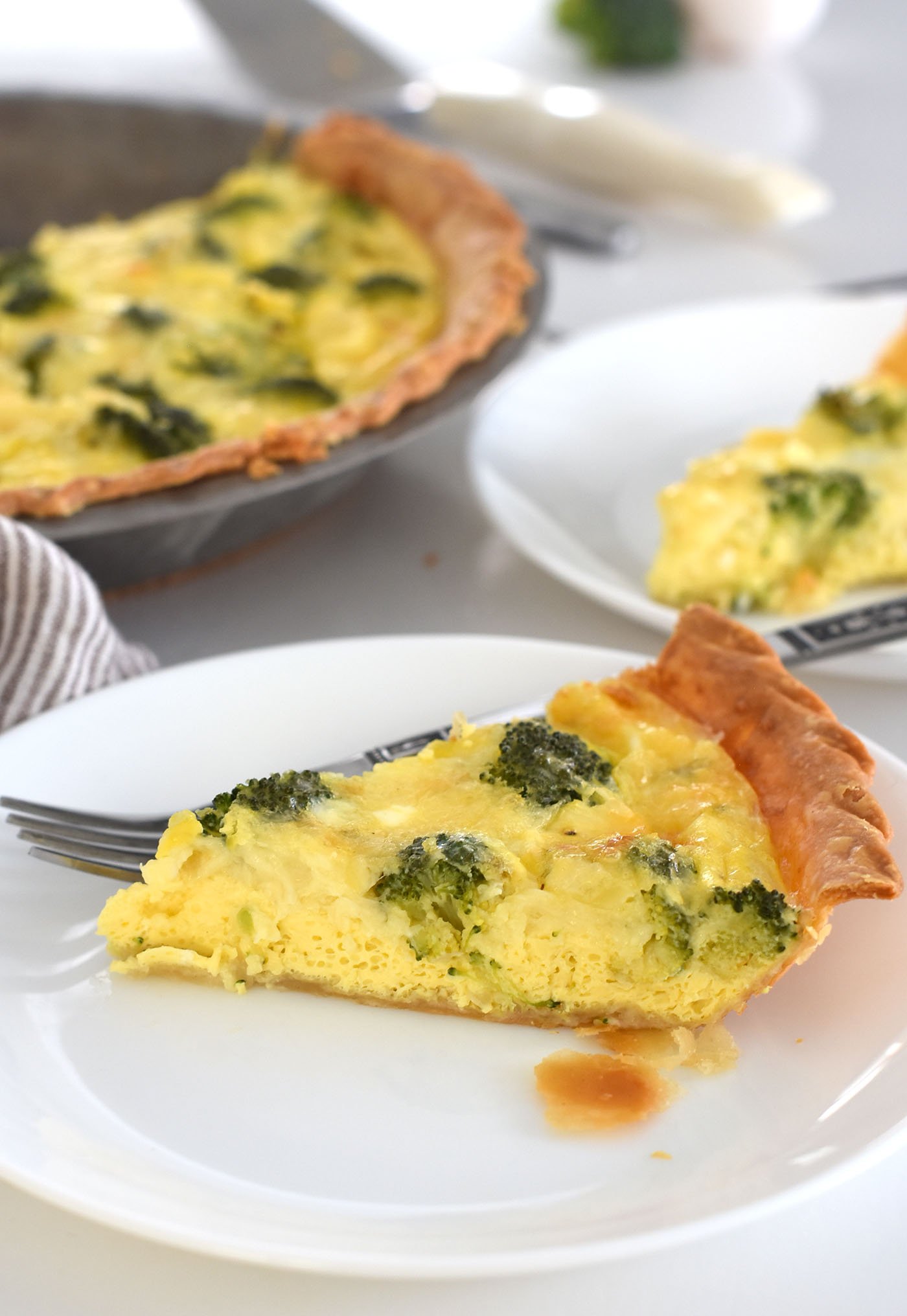 broccoli and cheese quiche on a plate