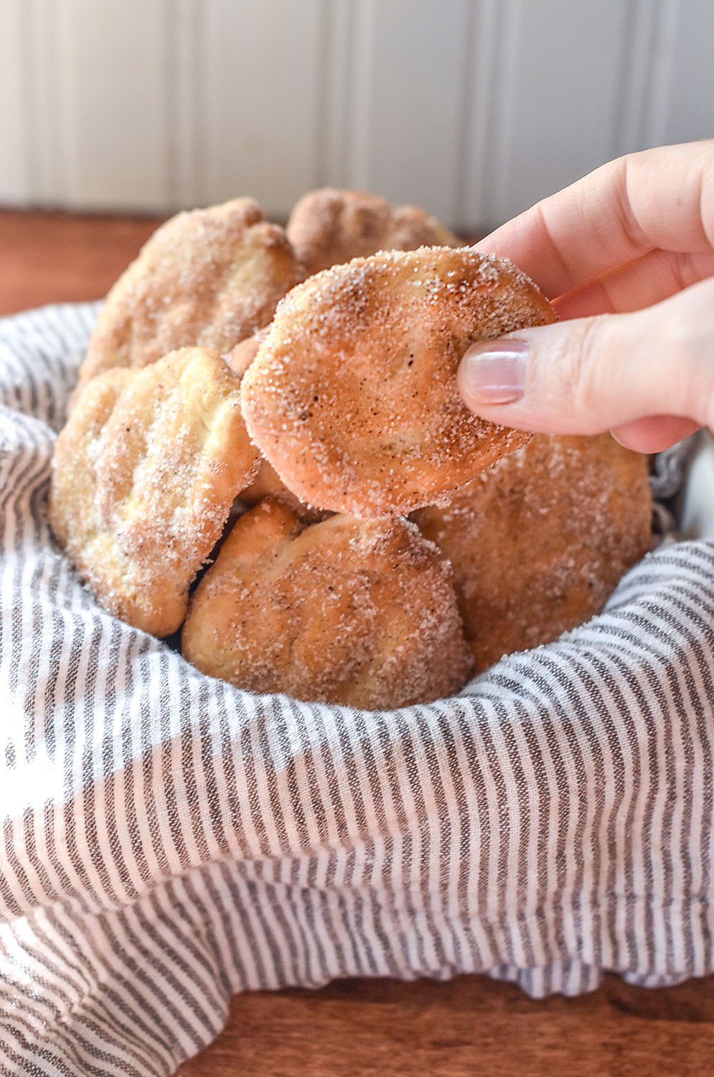 Bread dough fried in the air fryer and coated with cinnamon and sugar.