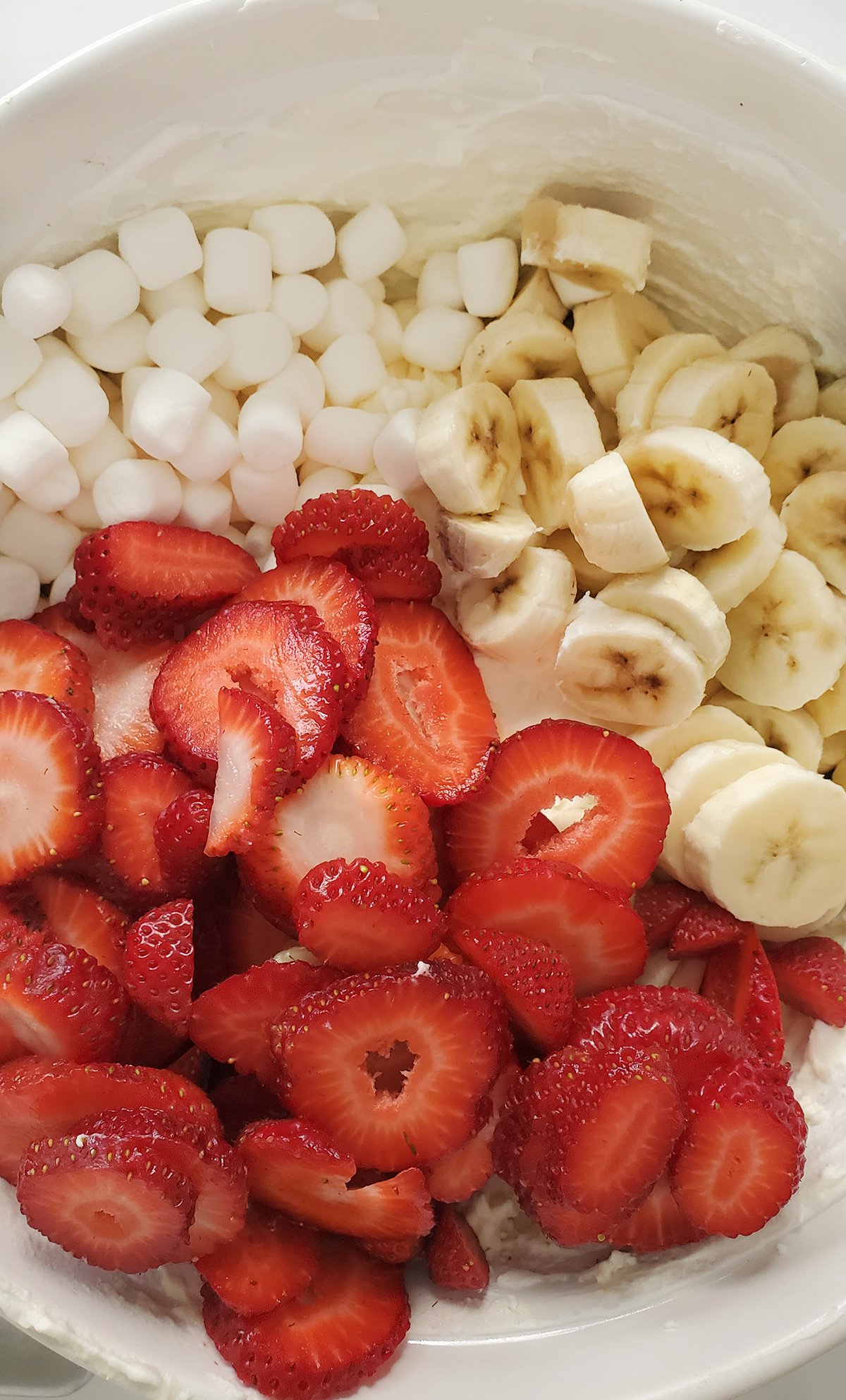 strawberries, banana, and marshmallows for strawberry cheesecake salad